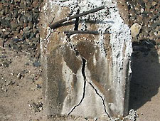 Cracked concrete pedestal ready for removal. Cracked concrete pedestal ready for removal.